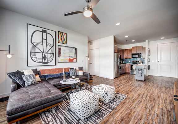 an open living room and kitchen with a couch and a table