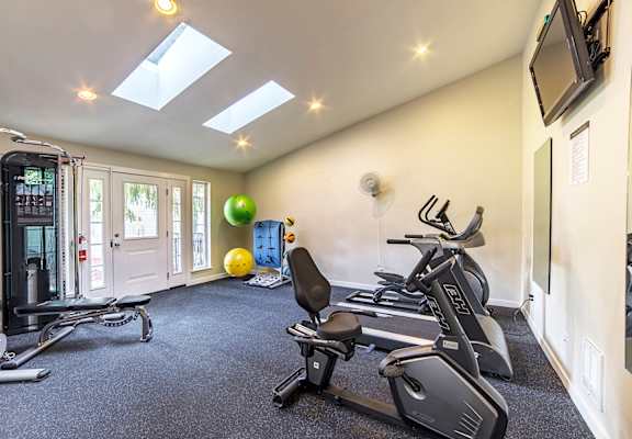 a gym with treadmills and exercise balls on the floor  at Arterra, Kent, 98030