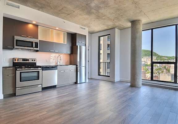 a kitchen with stainless steel appliances and a large window