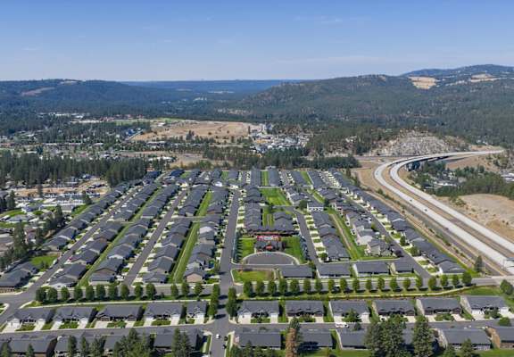 A large suburban housing development with a highway running through it.