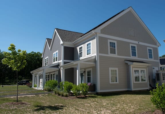 a large house with a grassy area in front of it