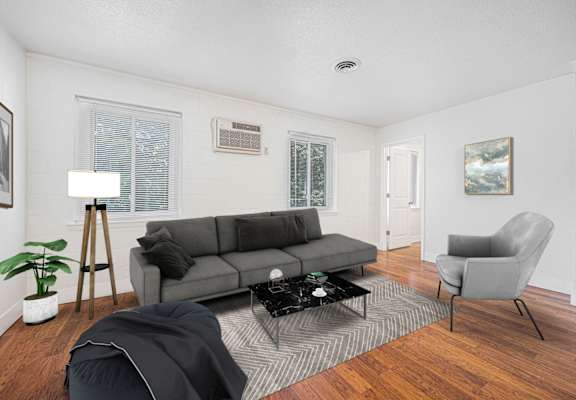 a living room with a couch and a chair