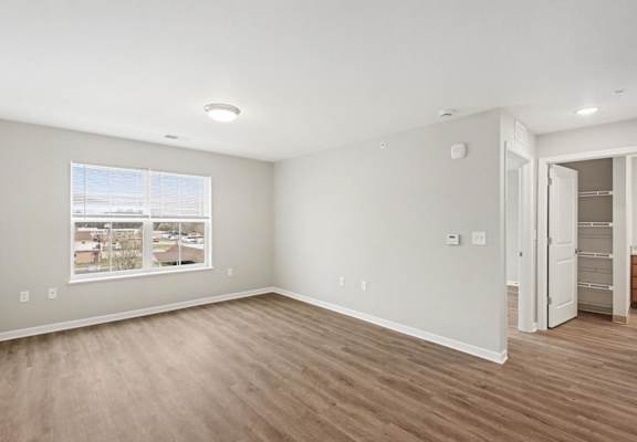 A room with a window and a door.