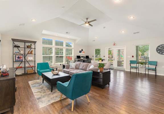 a living room with a vaulted ceiling and hardwood floors