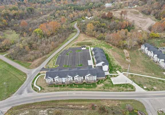 a view of a building from the air with a road