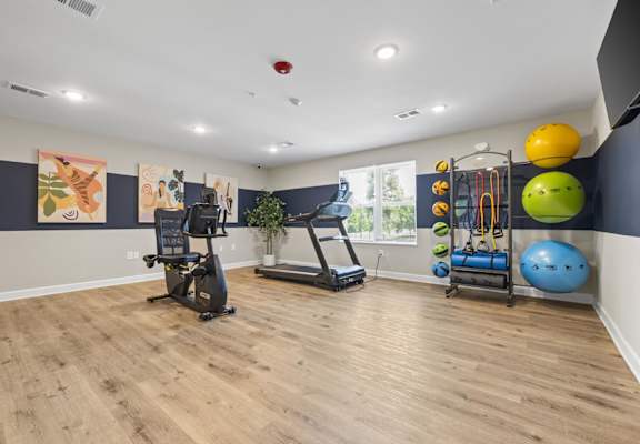 A home gym with a variety of exercise equipment.