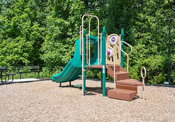 a playground with a slide and stairs