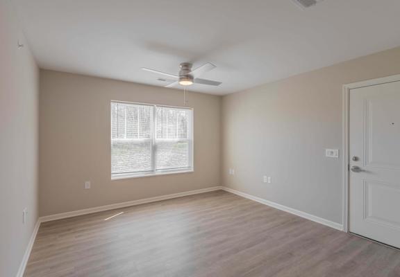 A room with a window and a door.