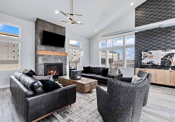A modern living room with a fireplace and a television.