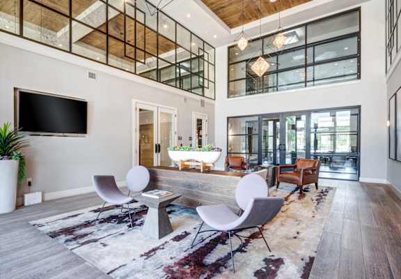 a large open living room with a tub in the middle of the room at AMARA, San Antonio, 78257