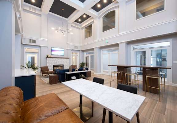 A large room with a long table and chairs. at Vivant Woodholme, Pikesville