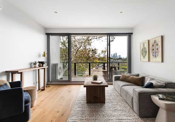A modern living room with a view of the city.