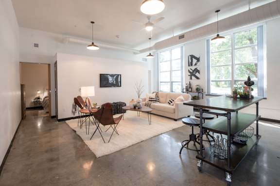 A modern open plan living and dining area with a kitchen island.