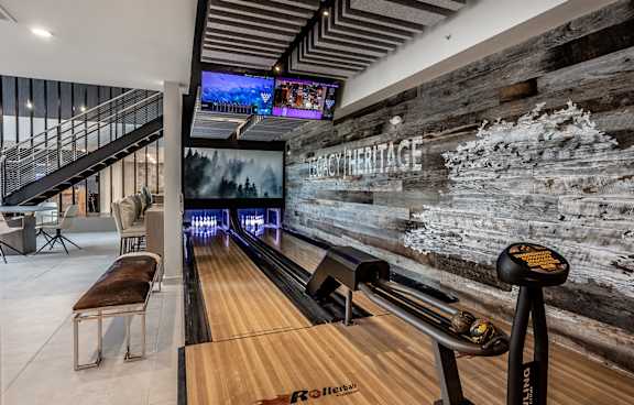 Indoor gaming lounge with billiards, foosball table, shuffleboard and mini bowling lane