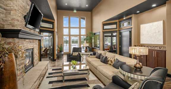 a living room with a couch and a fireplace and a television