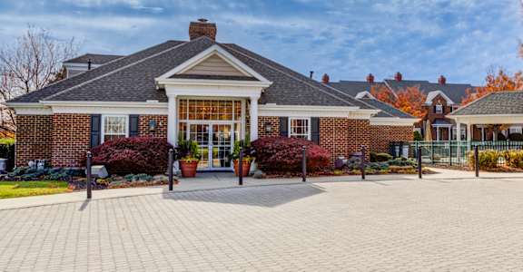 A brick house with a large front yard at Highlands at Warwick Apartments, Pennsylvania 17543