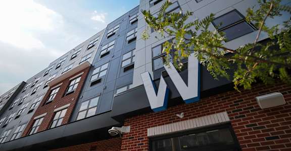A modern building with a large W on the top. at Walnut View Apartments, Allentown, PA, 18102
