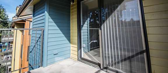 a sliding glass door opens to the patio of a house