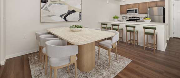 A modern dining room with a large table and chairs.