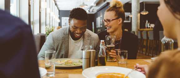 Lifestyle image of friends eating dinner at an eatery in Texas, 77388
