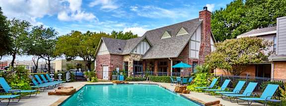 A large swimming pool with Fusion Crossroads Apartments in the background.