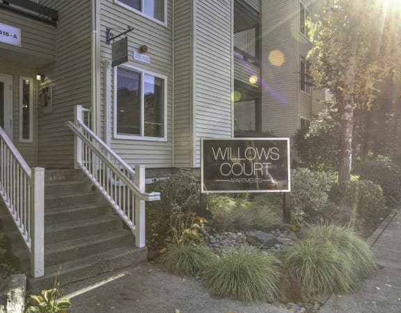 the exterior of willows court with a sign that reads willow court