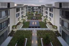 Inner courtyard with a water feature and sitting area.
