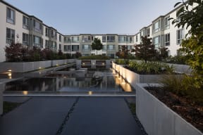 Inner courtyard with a water feature and sitting area.