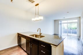 Kitchen island and balcony view - Apartments at 2828 Zuni