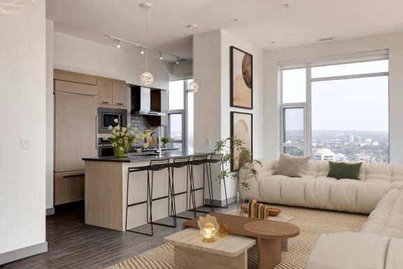 a living room and kitchen in an apartment at Versus, Calgary