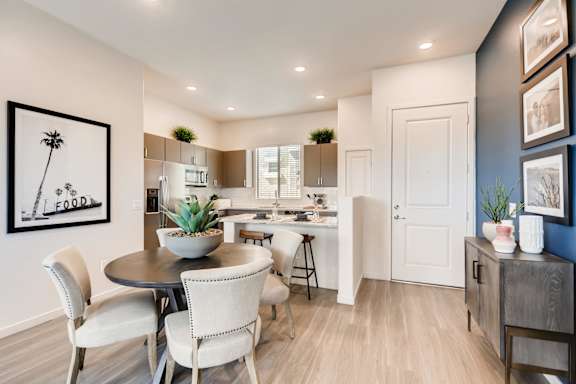 A modern dining room with a round table and chairs. at Avilla Meadows  Apartments, Surprise, AZ, 85379