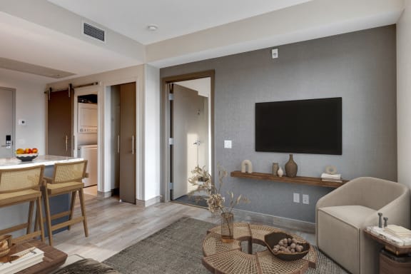 a living room with a couch and a table and a television