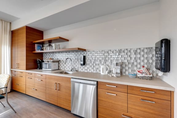 a kitchen with wooden cabinets and a counter top and a sink