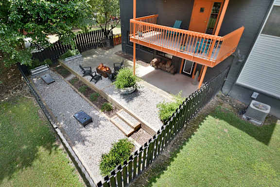 an aerial view of a backyard with a deck and a fire pit at Capital Flats & Magnolia Square Apartments, Raleigh, 27601