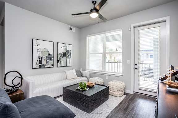 Living room and patio with storage in model
