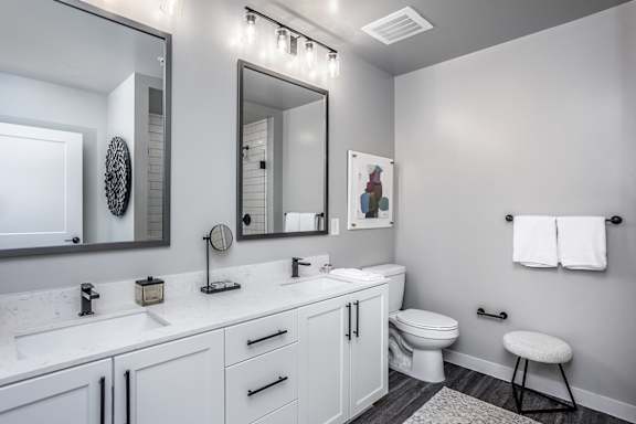 Dual vanities and framed mirrors in bathrooms