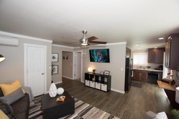 View of Timber Creek living room looking into the kitchen
