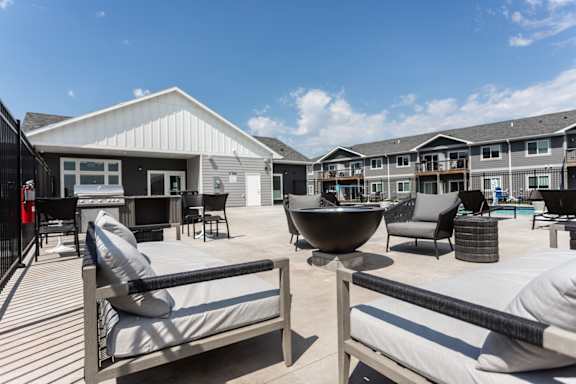 A sunny day at a resort with a black and white striped building in the background.