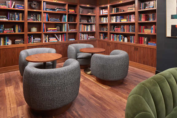 a rendering of a living room with a library