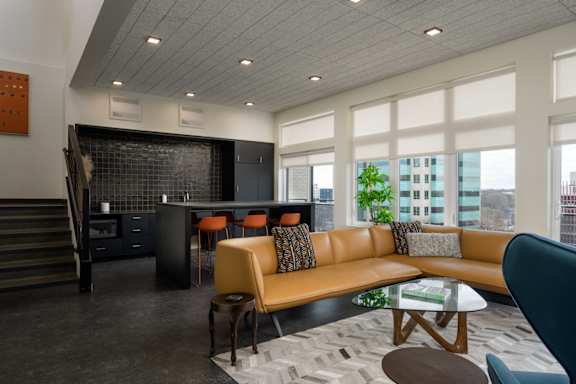 a living room with a couch and a table at The Lucy Boise Apartments, Boise