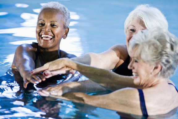 elder women inside a pool-Senior Living at Matthew Henson Apartments Phoenix, AZ