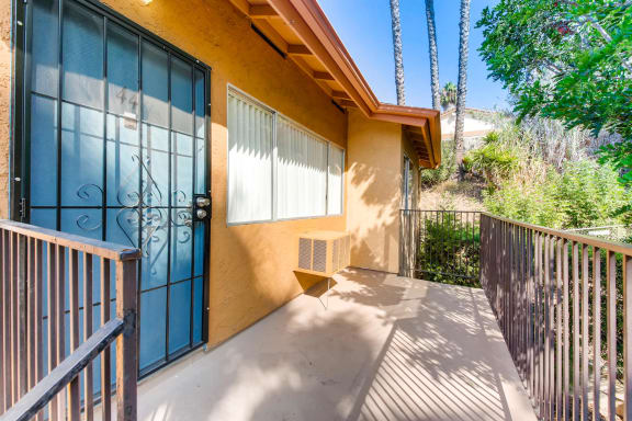 An Upstairs Front Entry Landing at Vista Flores Apartments