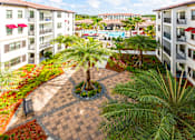 Thumbnail 41 of 45 - Courtyard view at Orchid Run Apartments, Naples, Florida