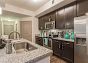 Thumbnail 2 of 45 - Kitchen and dining at Orchid Run Apartments, Naples, FL