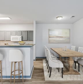 •	Parc at Metro Center Apartments in Nashville, TN photo of a dining room with a table and chairs and a kitchen