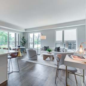 a living room with a kitchen and a dining room