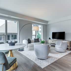 a living room with a couch and a table and a tv