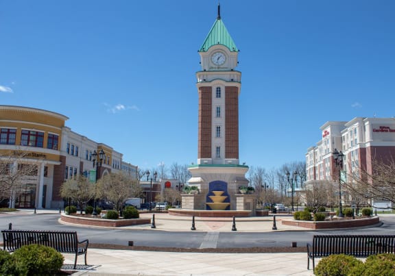 a clock tower in the middle of a town square