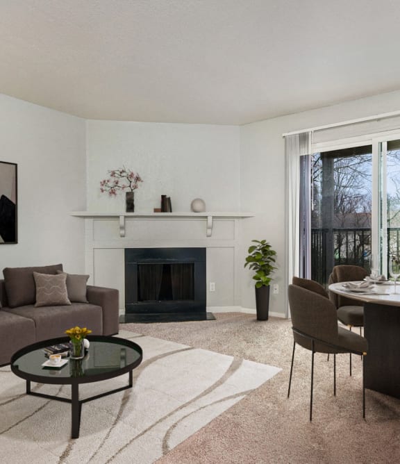 a living room with a couch and a table and a fireplace