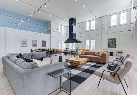 a living room filled with furniture and a large fireplace